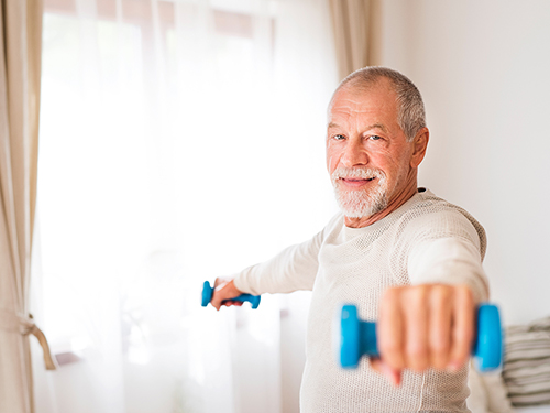 Man exercising at home.>